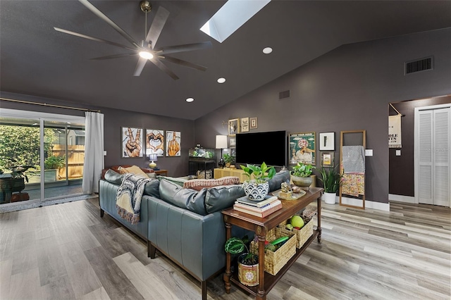 1313 W Carissa Ct, Tampa, FL 33604 - living room featuring a ceiling fan, high vaulted ceiling, wood finished floors, a skylight, and recessed lighting