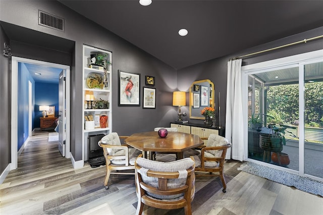 1313 W Carissa Ct, Tampa, FL 33604 - dining space featuring vaulted ceiling, light wood-style floors, and recessed lighting