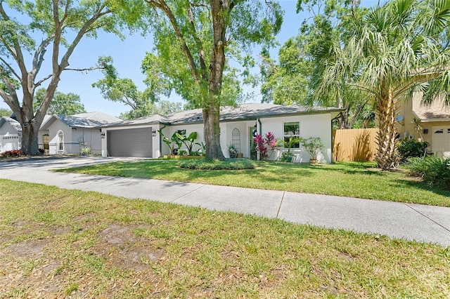 1313 W Carissa Ct, Tampa, FL 33604 - single story home with concrete driveway, a garage, and stucco siding