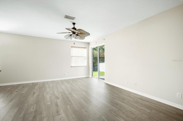 11132 Creek Haven Dr, Riverview, FL 33569 - spare room with wood finished floors and a ceiling fan