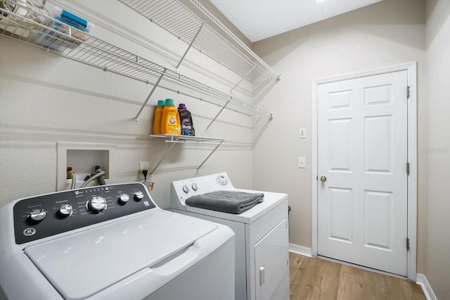11132 Creek Haven Dr, Riverview, FL 33569 - laundry area with washer and clothes dryer and light wood finished floors