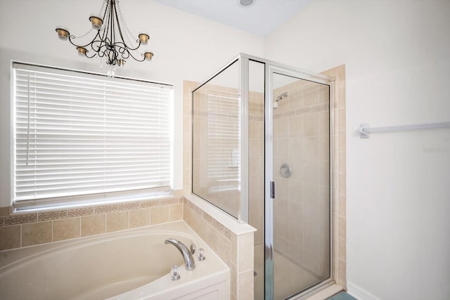11132 Creek Haven Dr, Riverview, FL 33569 - full bath featuring a garden tub, a stall shower, and a chandelier