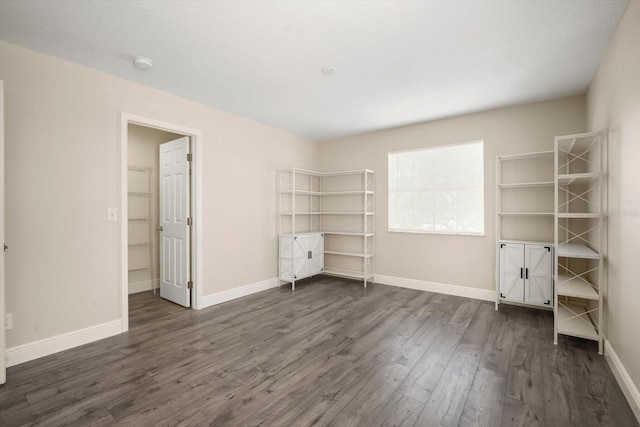 11132 Creek Haven Dr, Riverview, FL 33569 - unfurnished bedroom with dark wood-type flooring and baseboards