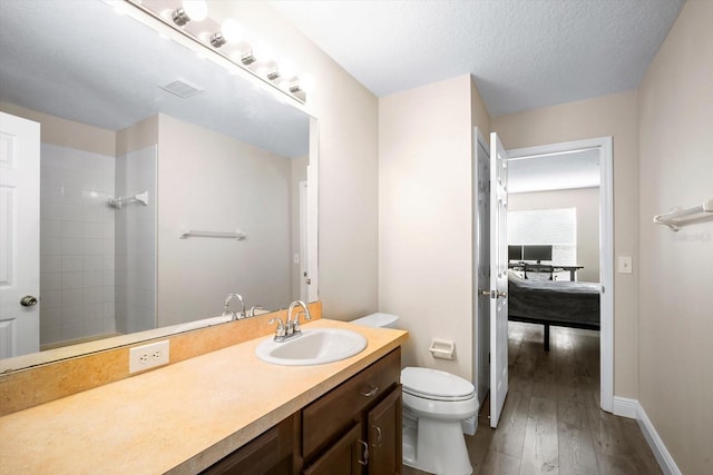 11132 Creek Haven Dr, Riverview, FL 33569 - bathroom featuring wood finished floors, vanity, and tiled shower