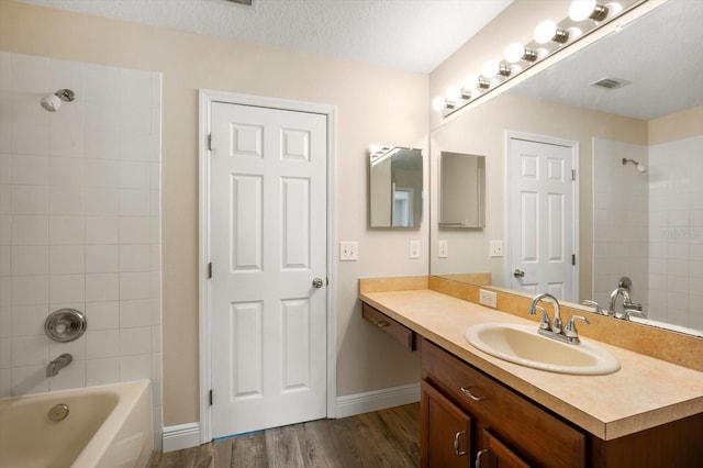 11132 Creek Haven Dr, Riverview, FL 33569 - full bath featuring wood finished floors, vanity, and shower / tub combination