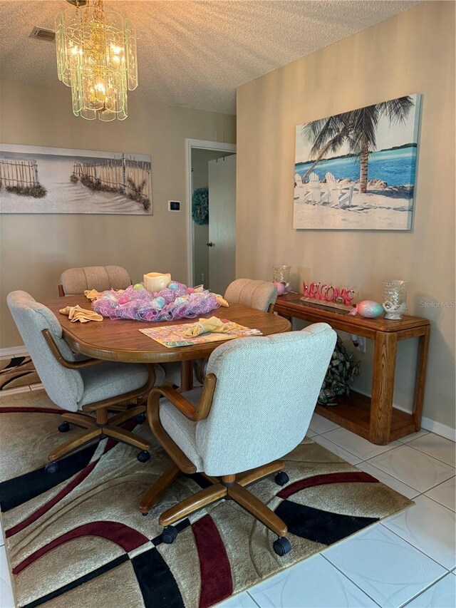 17569 SE 107th Ct, Summerfield, FL 34491 - dining room featuring a textured ceiling and a chandelier