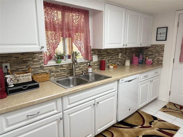 17569 SE 107th Ct, Summerfield, FL 34491 - kitchen featuring white dishwasher, white cabinetry, and tasteful backsplash