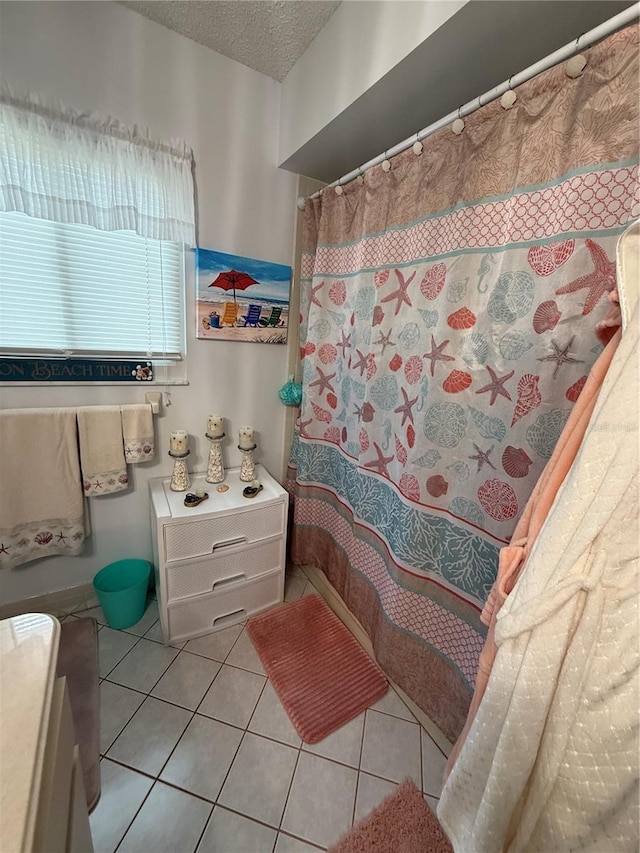 17569 SE 107th Ct, Summerfield, FL 34491 - full bath with tile patterned flooring, a textured ceiling, and a shower with shower curtain