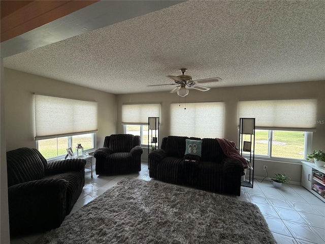 17569 SE 107th Ct, Summerfield, FL 34491 - living room with light tile patterned floors, ceiling fan, plenty of natural light, and a textured ceiling