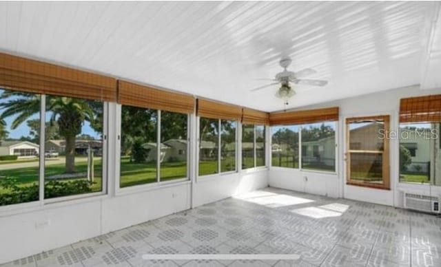 17569 SE 107th Ct, Summerfield, FL 34491 - unfurnished sunroom with a ceiling fan