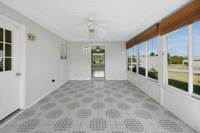 17569 SE 107th Ct, Summerfield, FL 34491 - unfurnished sunroom featuring plenty of natural light and tile patterned floors