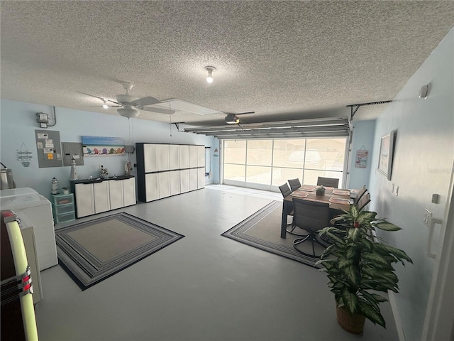 17569 SE 107th Ct, Summerfield, FL 34491 - garage with a ceiling fan, a garage door opener, washer / clothes dryer, a desk, and electric panel