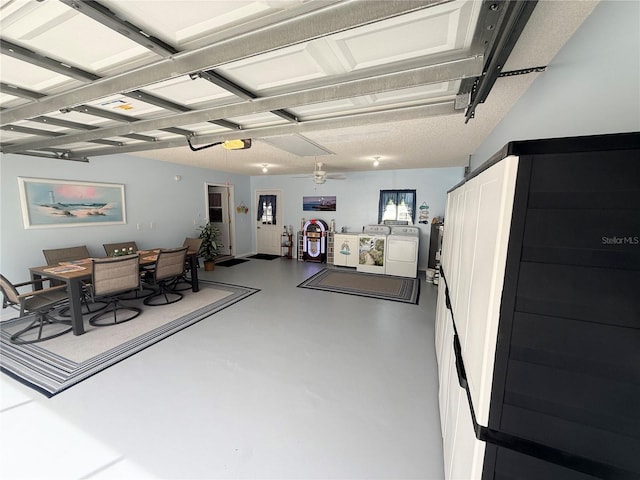 17569 SE 107th Ct, Summerfield, FL 34491 - garage with separate washer and dryer, a garage door opener, and a desk