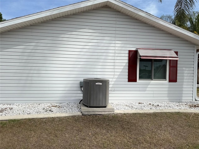 17569 SE 107th Ct, Summerfield, FL 34491 - view of side of home with a central AC unit