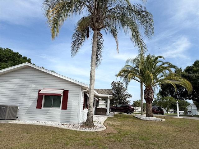 17569 SE 107th Ct, Summerfield, FL 34491 - view of side of property with a yard