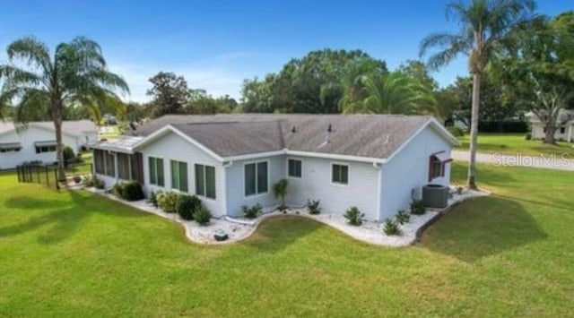 17569 SE 107th Ct, Summerfield, FL 34491 - back of property featuring a lawn