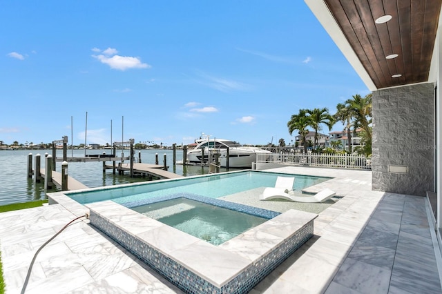 905 Bay Point Dr, Madeira Beach, FL 33708 - view of swimming pool featuring boat lift, a dock, an in-ground hot tub, and a water view