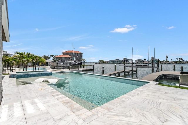 905 Bay Point Dr, Madeira Beach, FL 33708 - swimming pool featuring a boat dock, boat lift, and a water view