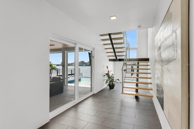 905 Bay Point Dr, Madeira Beach, FL 33708 - stairway featuring a water view