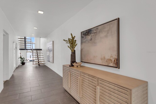 905 Bay Point Dr, Madeira Beach, FL 33708 - corridor with floor to ceiling windows and stairs