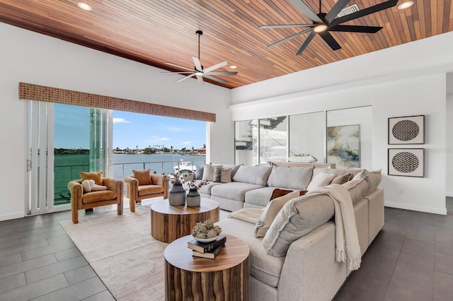 905 Bay Point Dr, Madeira Beach, FL 33708 - living area with a ceiling fan, wood ceiling, recessed lighting, and a water view