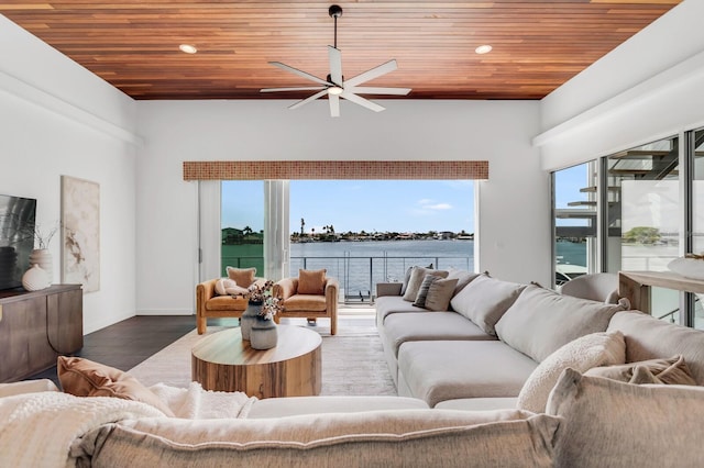 905 Bay Point Dr, Madeira Beach, FL 33708 - living area with ceiling fan, wooden ceiling, a water view, wood finished floors, and recessed lighting