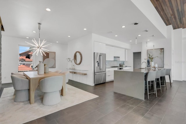 905 Bay Point Dr, Madeira Beach, FL 33708 - dining area with recessed lighting and a chandelier