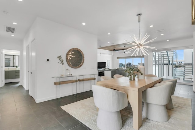 905 Bay Point Dr, Madeira Beach, FL 33708 - dining room with recessed lighting, a chandelier, tile patterned floors, and a ceiling fan