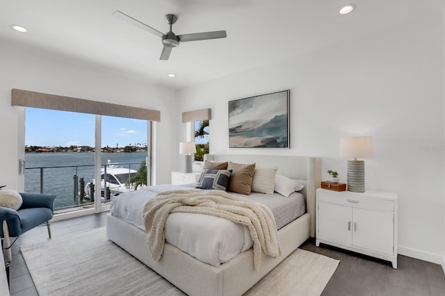 905 Bay Point Dr, Madeira Beach, FL 33708 - bedroom featuring access to outside, multiple windows, recessed lighting, a water view, and a ceiling fan