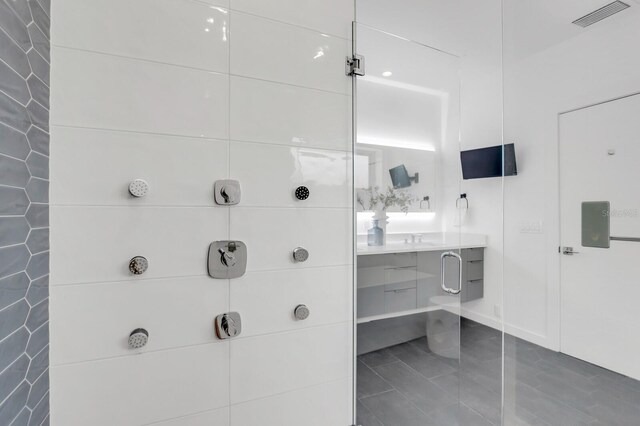 905 Bay Point Dr, Madeira Beach, FL 33708 - bathroom with vanity and baseboards