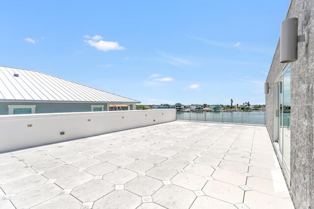905 Bay Point Dr, Madeira Beach, FL 33708 - view of patio / terrace with a water view