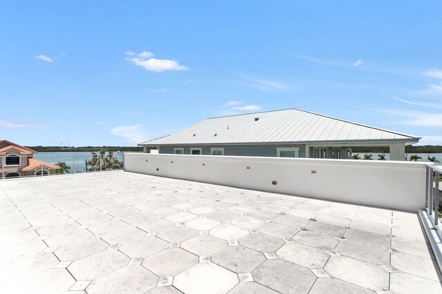 905 Bay Point Dr, Madeira Beach, FL 33708 - view of patio / terrace featuring a water view