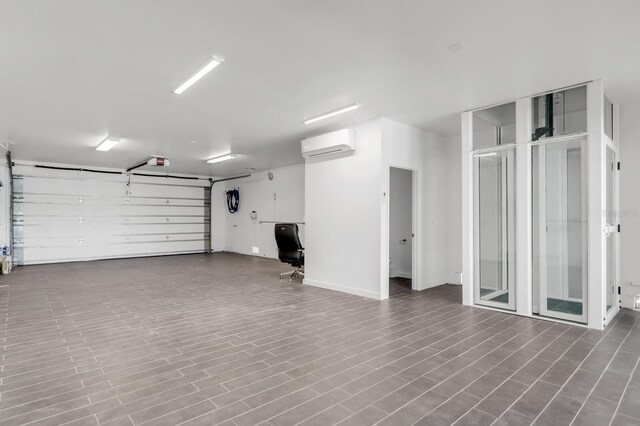 905 Bay Point Dr, Madeira Beach, FL 33708 - garage featuring a wall unit AC and a garage door opener