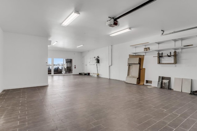 905 Bay Point Dr, Madeira Beach, FL 33708 - garage featuring a garage door opener