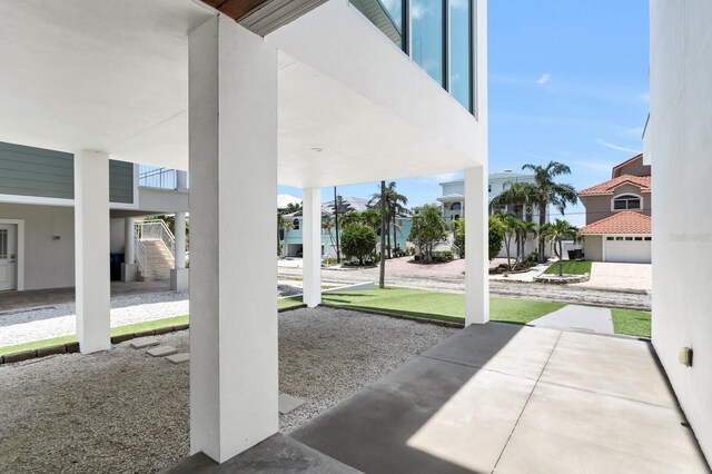 905 Bay Point Dr, Madeira Beach, FL 33708 - view of patio / terrace with stairway and a residential view