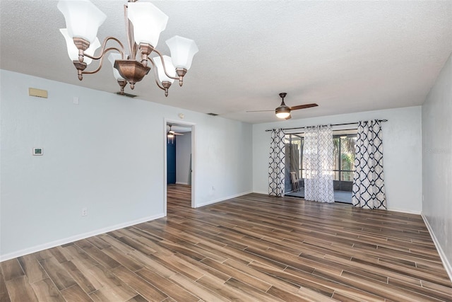 89 Fremont Ave Unit 504, Daytona Beach, FL 32114 - empty room featuring a ceiling fan, wood finished floors, a textured ceiling, and a chandelier