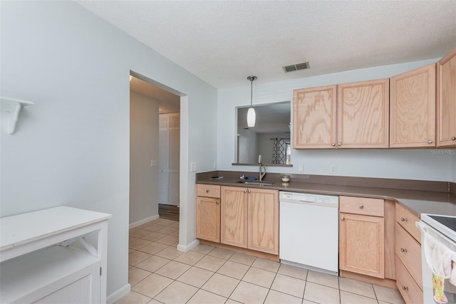 89 Fremont Ave Unit 504, Daytona Beach, FL 32114 - kitchen with white appliances, light brown cabinets, light tile patterned floors, decorative light fixtures, and dark countertops
