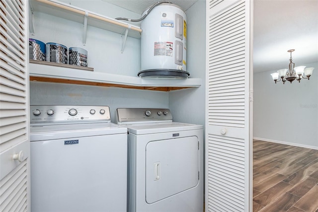 89 Fremont Ave Unit 504, Daytona Beach, FL 32114 - laundry room featuring water heater, separate washer and dryer, a chandelier, and wood finished floors
