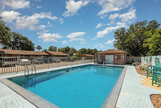 89 Fremont Ave Unit 504, Daytona Beach, FL 32114 - community pool with a patio area and an outdoor structure