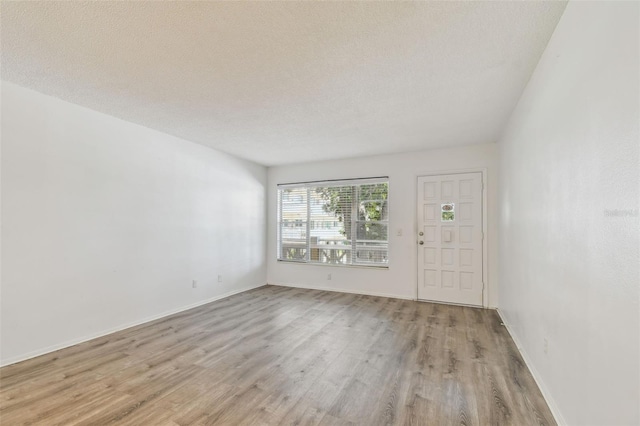 2310 Denmark St Unit 34, Clearwater, FL 33763 - entryway with light wood-style flooring and a textured ceiling