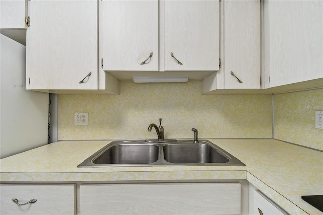 2310 Denmark St Unit 34, Clearwater, FL 33763 - kitchen featuring light countertops, tasteful backsplash, and black electric stovetop
