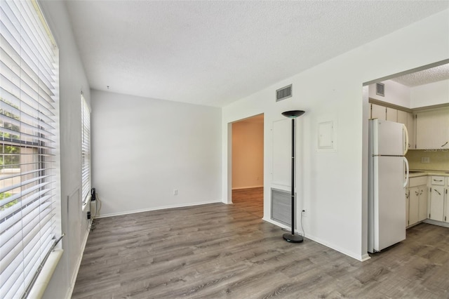 2310 Denmark St Unit 34, Clearwater, FL 33763 - spare room featuring light wood-style flooring and a textured ceiling