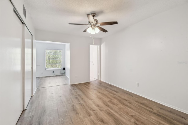2310 Denmark St Unit 34, Clearwater, FL 33763 - spare room with a ceiling fan, wood finished floors, and a textured ceiling