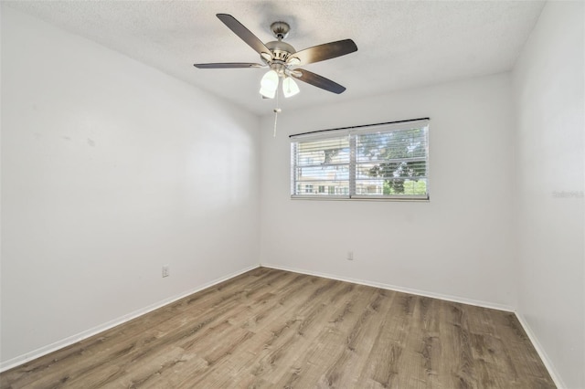 2310 Denmark St Unit 34, Clearwater, FL 33763 - spare room with light wood-type flooring, a textured ceiling, and ceiling fan