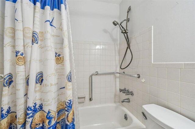 2310 Denmark St Unit 34, Clearwater, FL 33763 - bathroom featuring shower / bathtub combination with curtain and tile walls