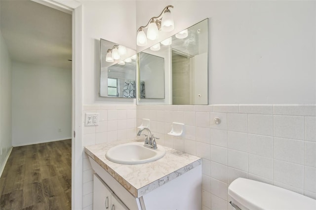 2310 Denmark St Unit 34, Clearwater, FL 33763 - bathroom with vanity, wood finished floors, and decorative backsplash
