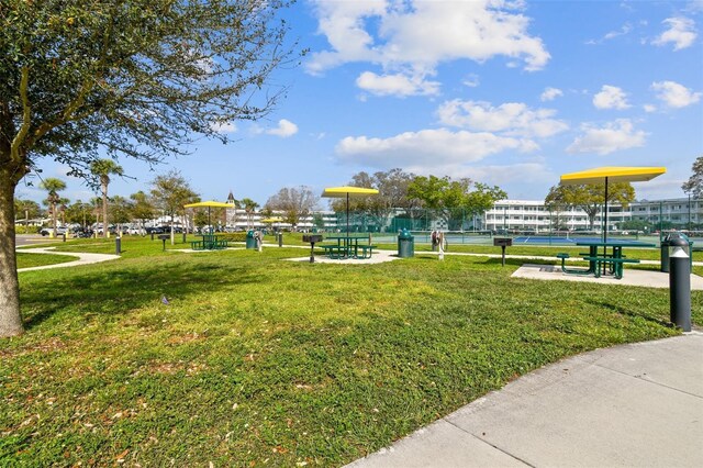 2310 Denmark St Unit 34, Clearwater, FL 33763 - view of property's community with a tennis court and a lawn