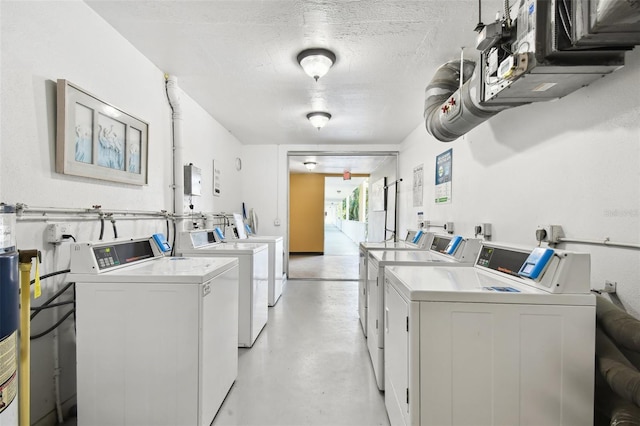 2310 Denmark St Unit 34, Clearwater, FL 33763 - community laundry with washer and clothes dryer and a textured ceiling