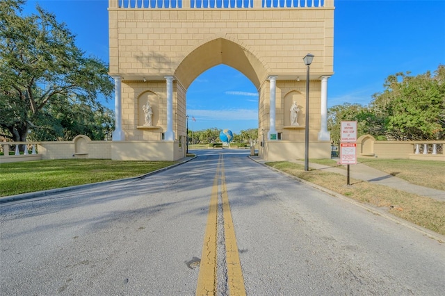 2310 Denmark St Unit 34, Clearwater, FL 33763 - view of asphalt road featuring street lighting, curbs, and traffic signs