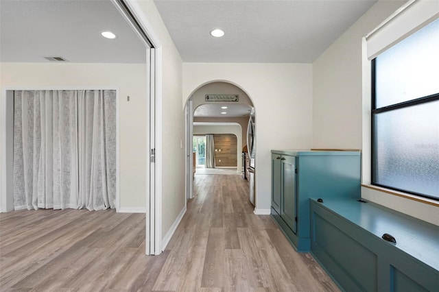 6814 68th Ave E, Bradenton, FL 34203 - hall with light wood-type flooring, arched walkways, and recessed lighting